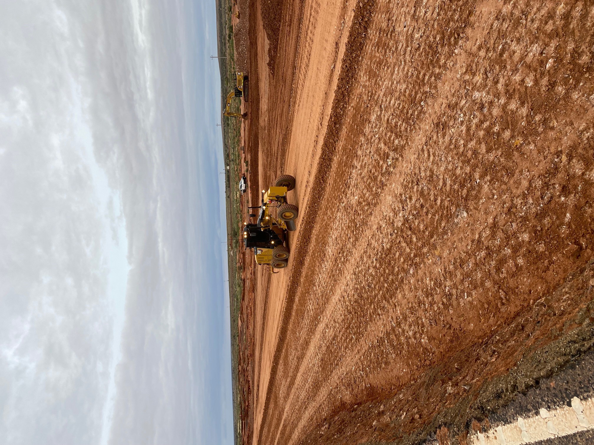 Close up view of an Excavator layering soil